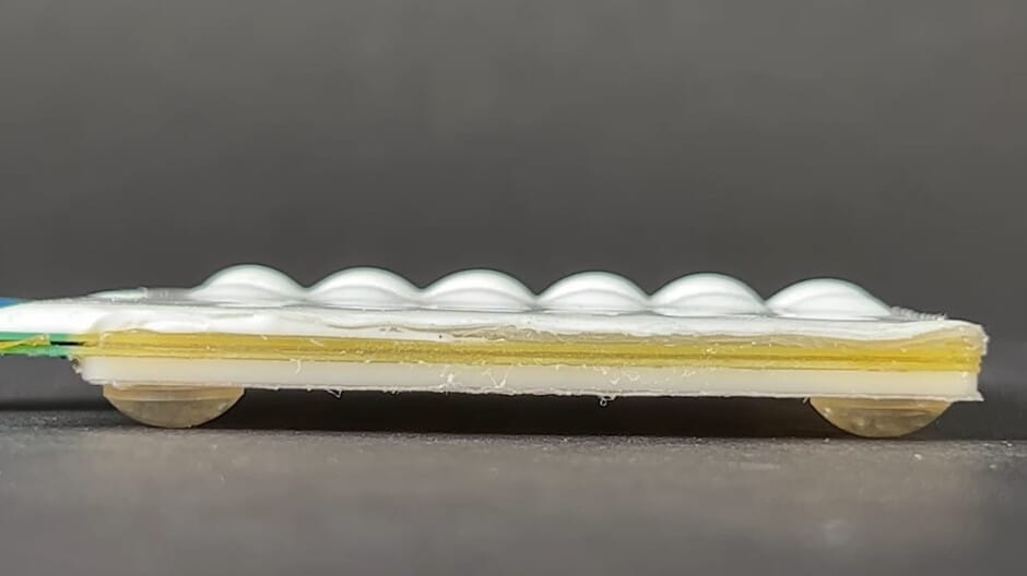 New tactile technology may allow for a pop-up keyboard on a flat smartphone display